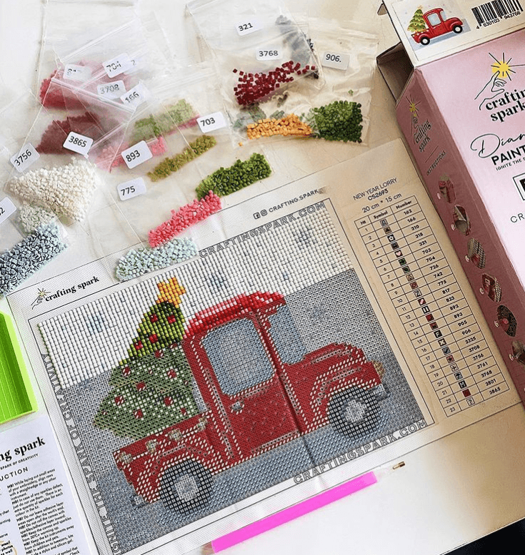 New Year Lorry CS2693 diamond painting kit with tools and pre-sorted acrylic diamonds, showcasing vibrant colors and detailed design.